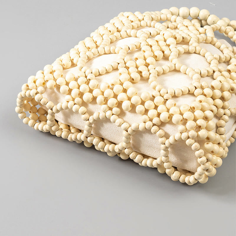 Handgewebte Handtasche mit runden, hohlen Holzperlen – Bohemian-Stil