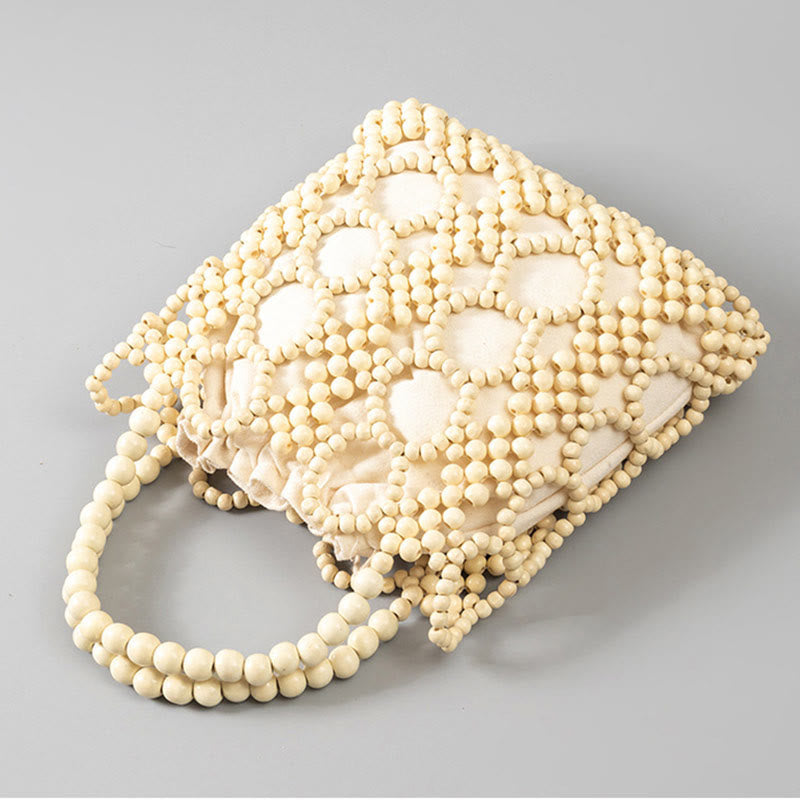 Handgewebte Handtasche mit runden, hohlen Holzperlen – Bohemian-Stil