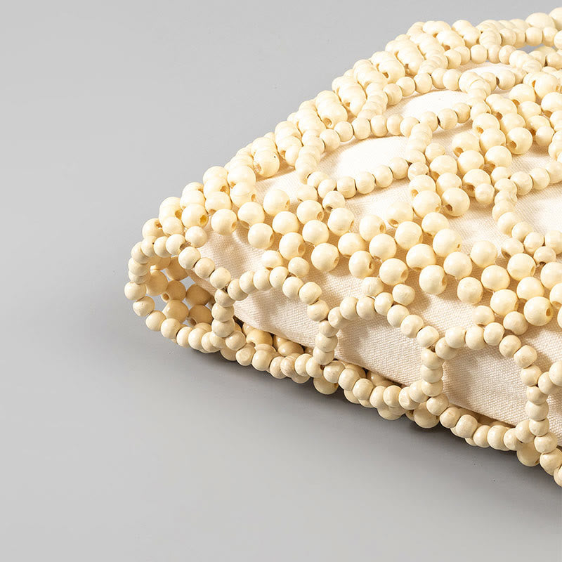 Handgewebte Handtasche mit runden, hohlen Holzperlen – Bohemian-Stil