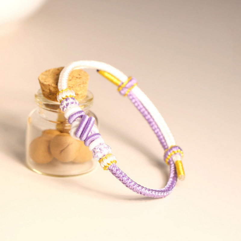 Handgefertigtes zweifarbiges Peace Knot-Armband aus roter Schnur