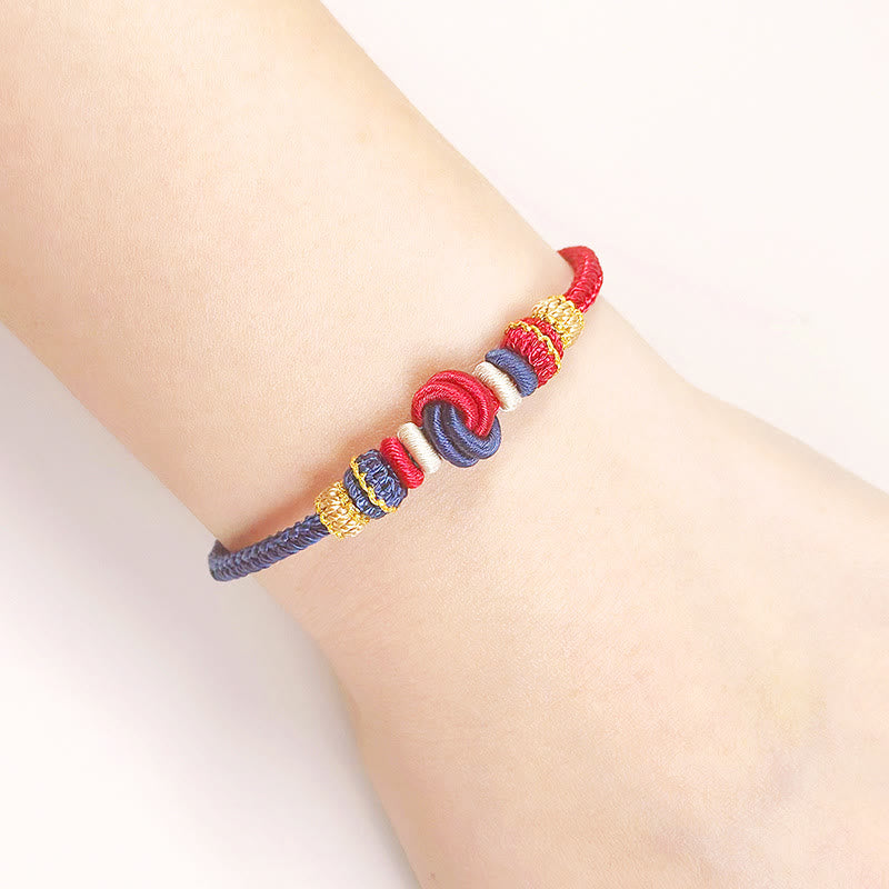 Handgefertigtes zweifarbiges Peace Knot-Armband aus roter Schnur