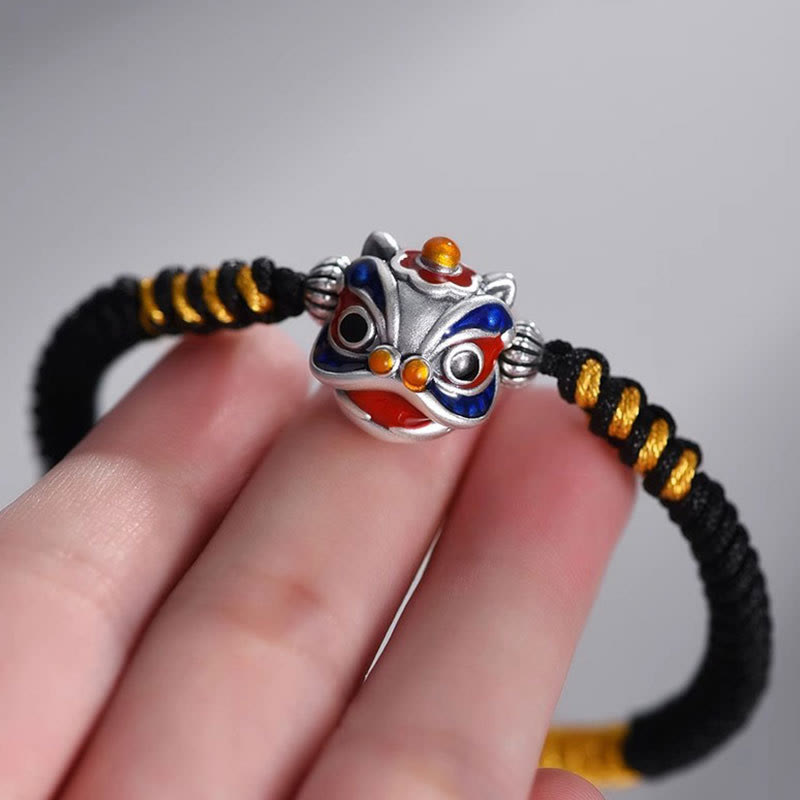 Handgemachtes tanzendes Löwenarmband mit roter Schnur zum Schutz