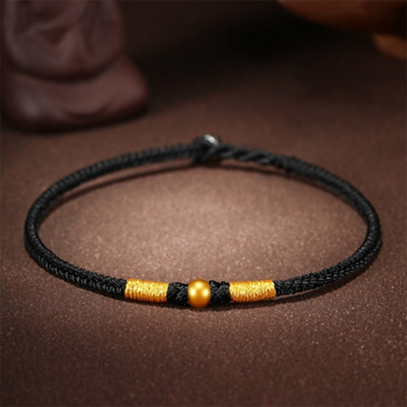 Handgefertigtes rotes Schnurarmband mit 999 Goldperlen und King Kong-Knoten zum Schutz