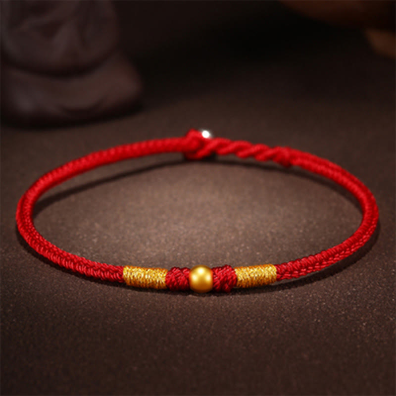 Handgefertigtes rotes Schnurarmband mit 999 Goldperlen und King Kong-Knoten zum Schutz