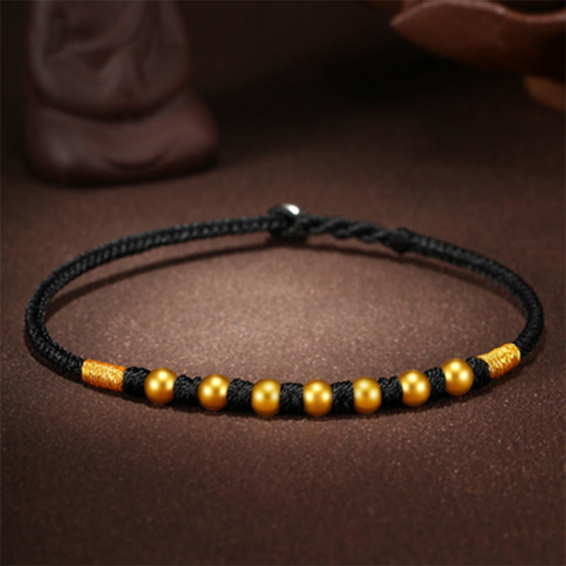Handgefertigtes rotes Schnurarmband mit 999 Goldperlen und King Kong-Knoten zum Schutz