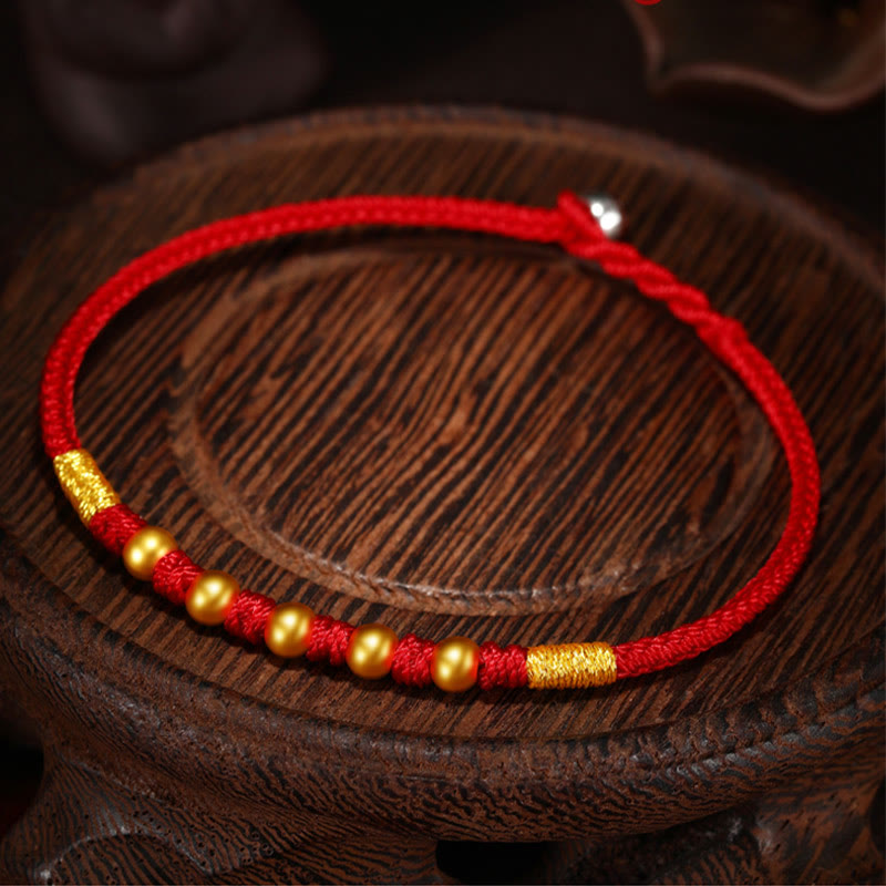 Handgefertigtes rotes Schnurarmband mit 999 Goldperlen und King Kong-Knoten zum Schutz