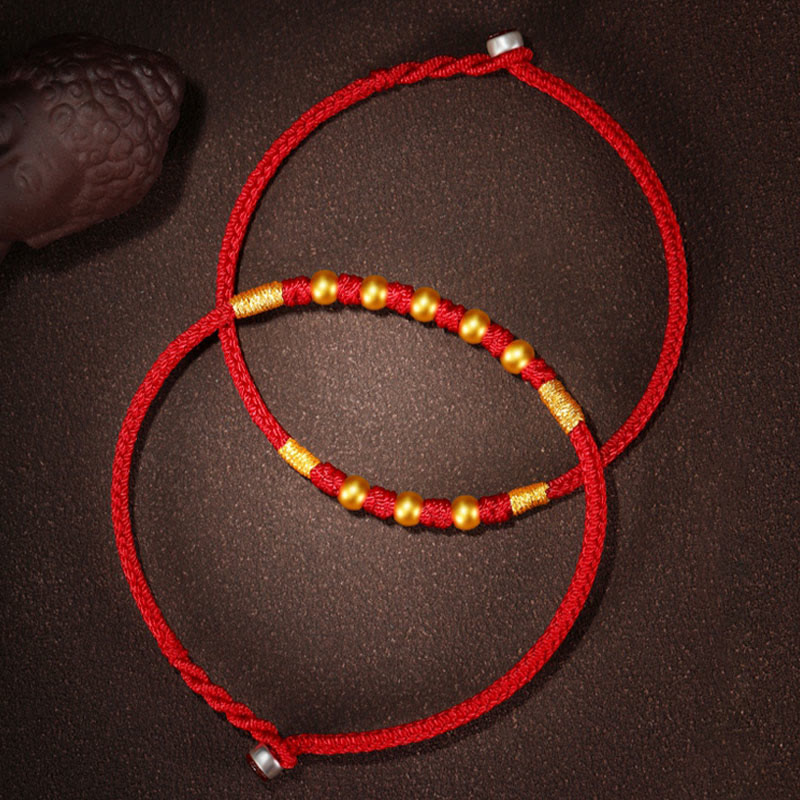 Handgefertigtes rotes Schnurarmband mit 999 Goldperlen und King Kong-Knoten zum Schutz