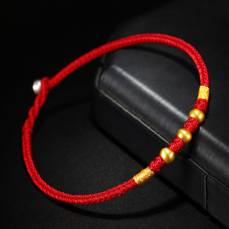 Handgefertigtes rotes Schnurarmband mit 999 Goldperlen und King Kong-Knoten zum Schutz