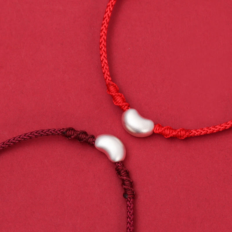 Handgemachtes rotes Schnurarmband 999 Sterling Silber Glückssymbol
