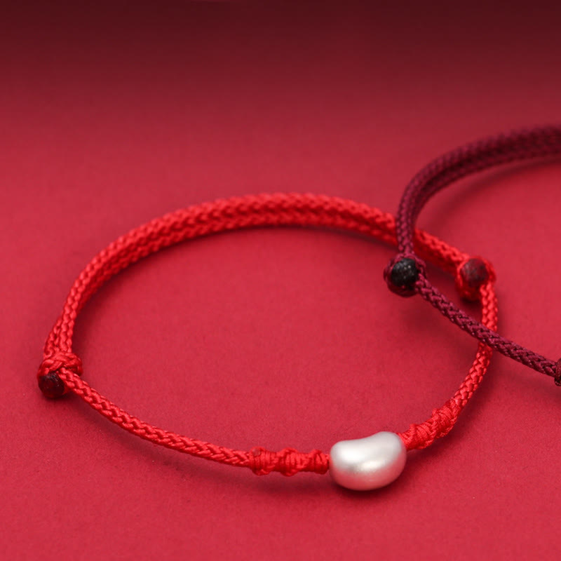 Handgemachtes rotes Schnurarmband 999 Sterling Silber Glückssymbol