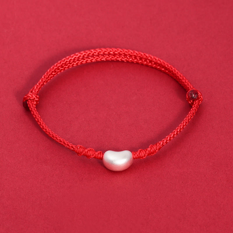 Handgemachtes rotes Schnurarmband 999 Sterling Silber Glückssymbol
