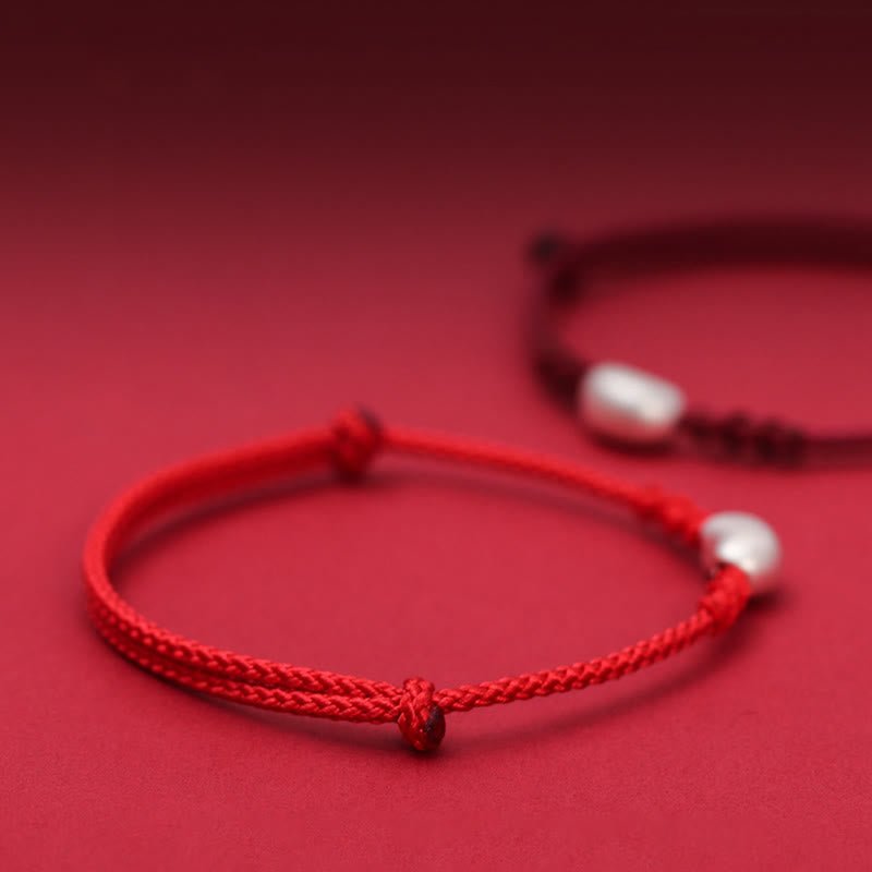 Handgemachtes rotes Schnurarmband 999 Sterling Silber Glückssymbol