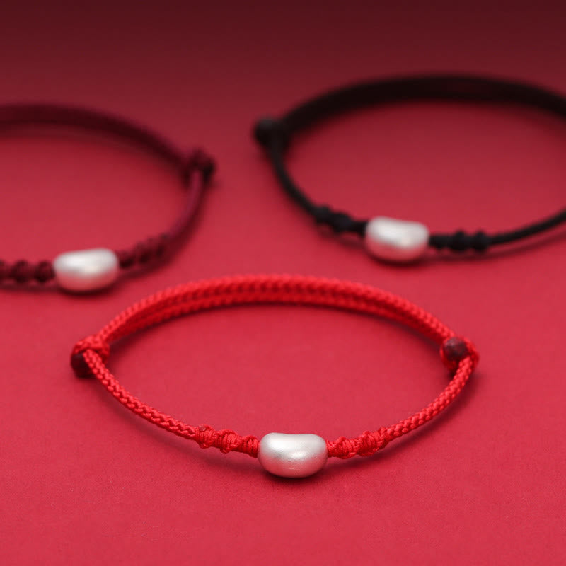 Handgemachtes rotes Schnurarmband 999 Sterling Silber Glückssymbol