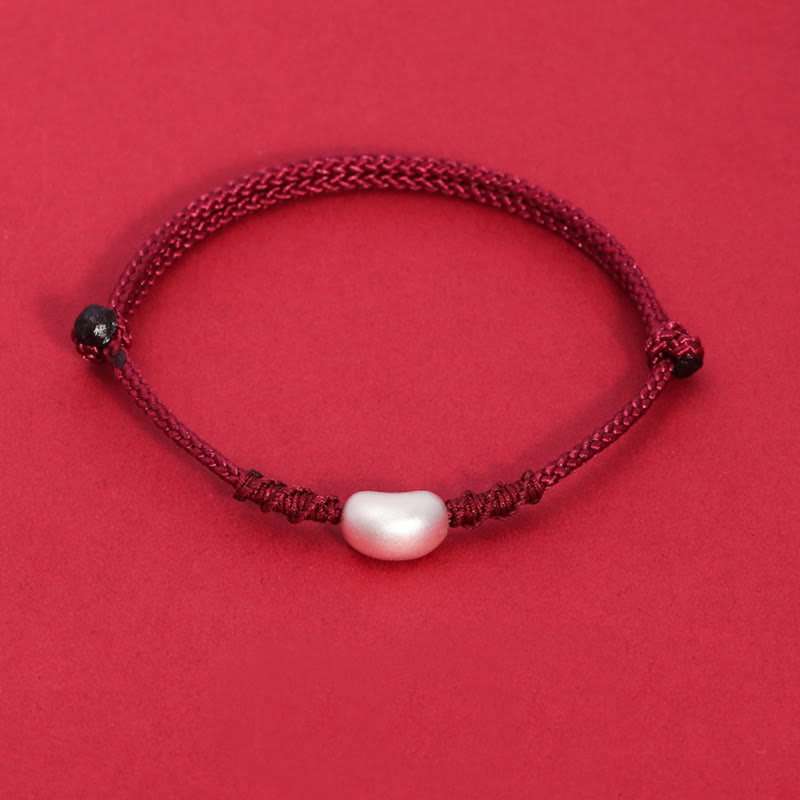 Handgemachtes rotes Schnurarmband 999 Sterling Silber Glückssymbol