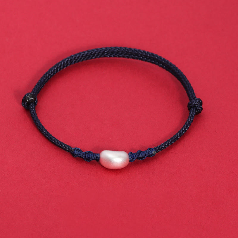 Handgemachtes rotes Schnurarmband 999 Sterling Silber Glückssymbol
