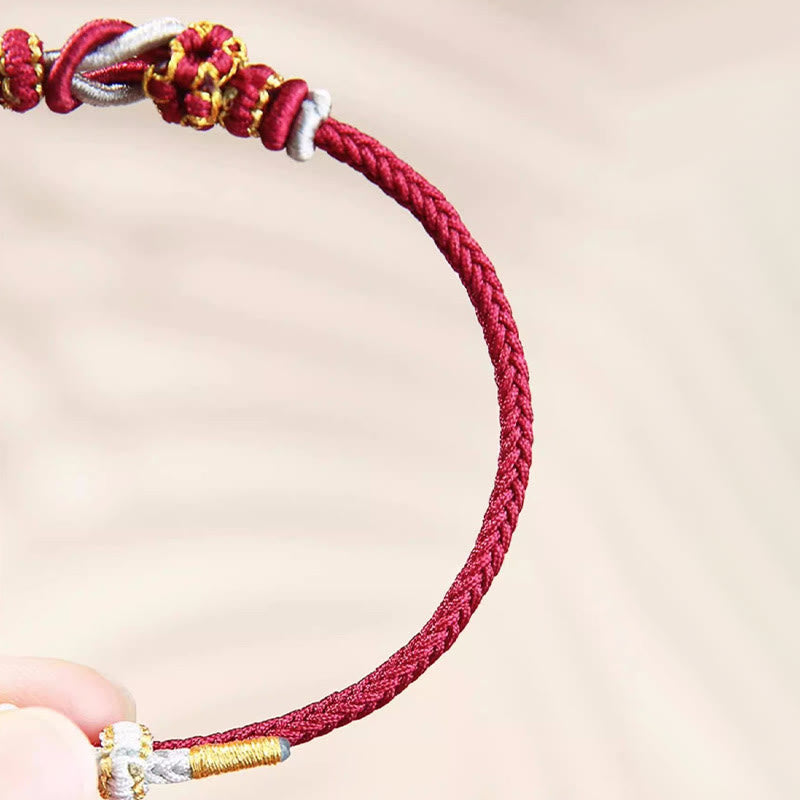 Handgemachtes rotes Schnurarmband mit acht Fäden, Friedensknoten, Schutz