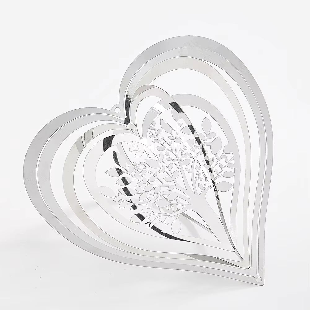 White metal heart decoration with floral cutouts in Heart Tree of Life Wind Spinner