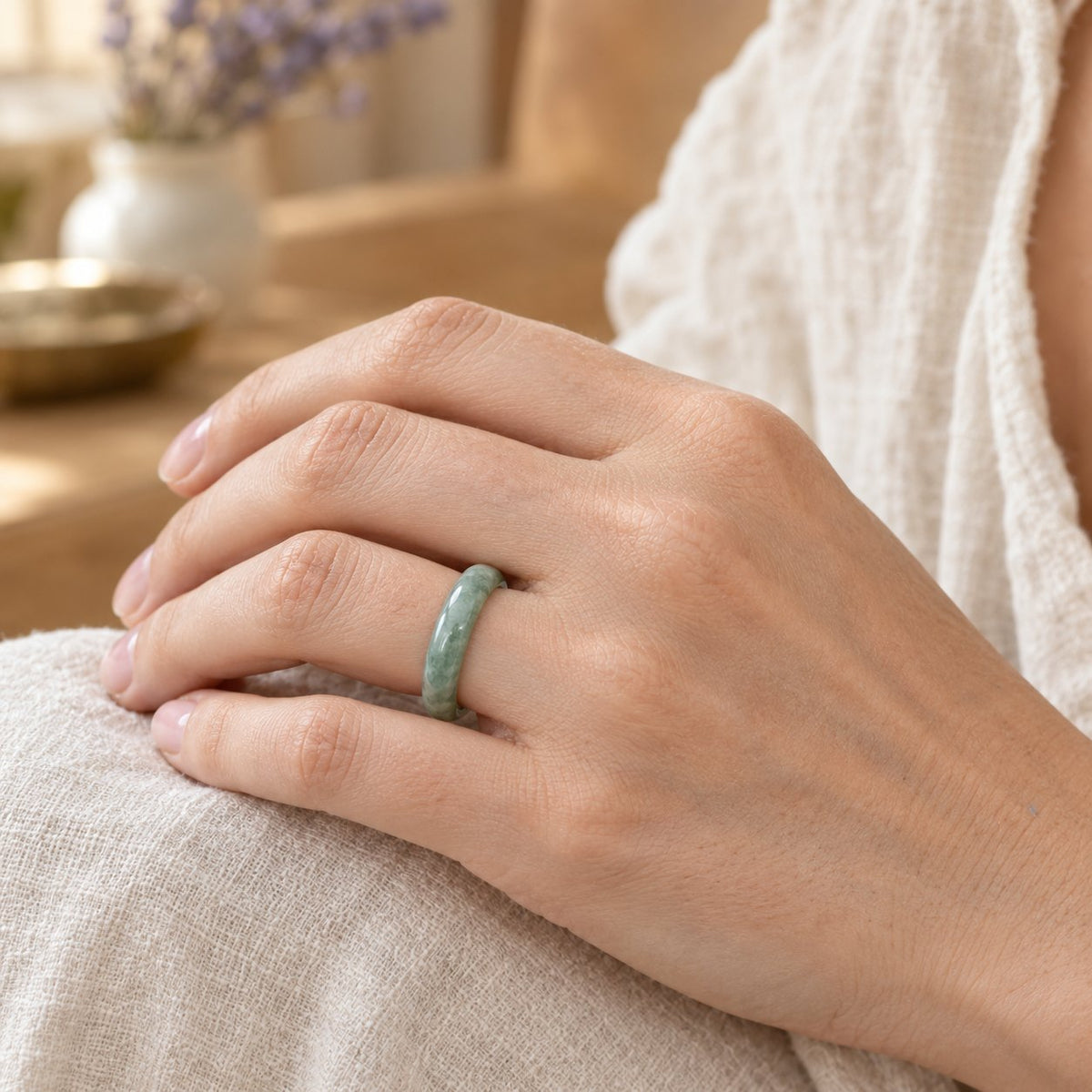 Jade Abundance Healing Ring, worn on the finger by a woman