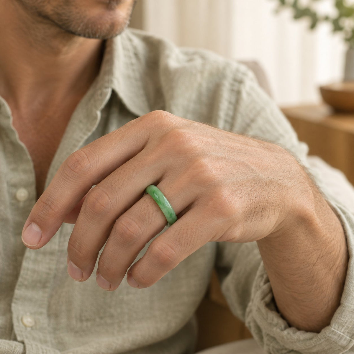 Unisex Jade Abundance Ring for Luck and Prosperity, worn on the finger by a man