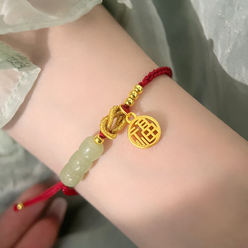 Jadeperlenarmband mit Fu-Anhänger an rotem Seil für Glück und Wohlstand