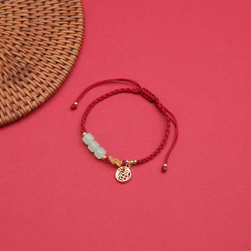Jadeperlenarmband mit Fu-Anhänger an rotem Seil für Glück und Wohlstand