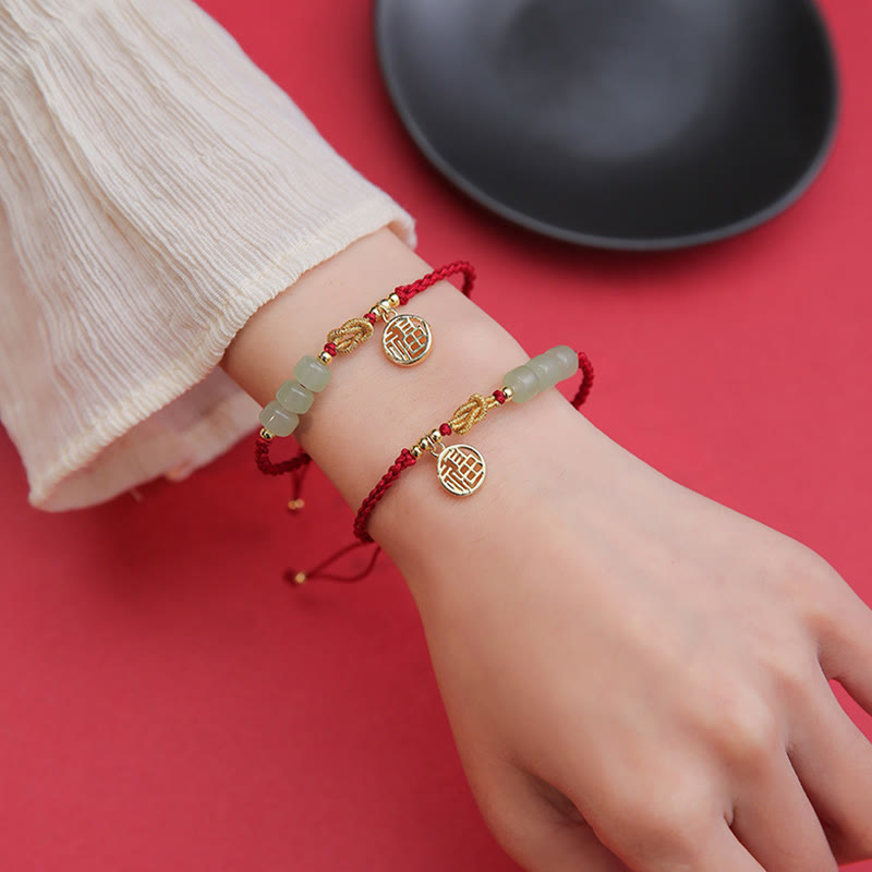 Jadeperlenarmband mit Fu-Anhänger an rotem Seil für Glück und Wohlstand