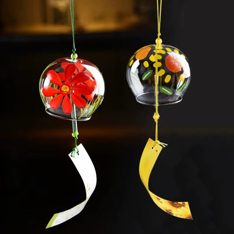 Japanese Glass Wind Chimes featuring floral designs and curved paper streamers for outdoor decor