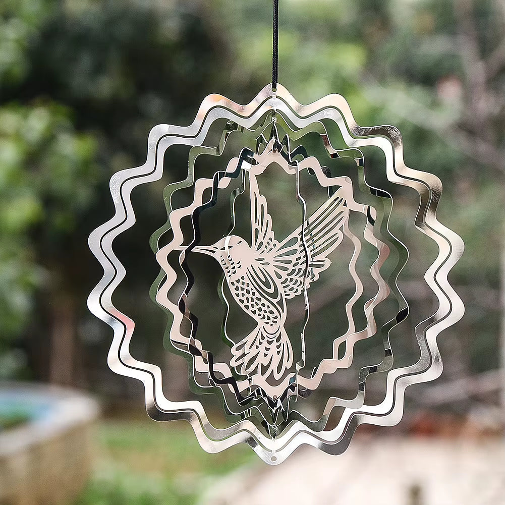 Metal wind spinner featuring a hummingbird design in wavy circles for gardens