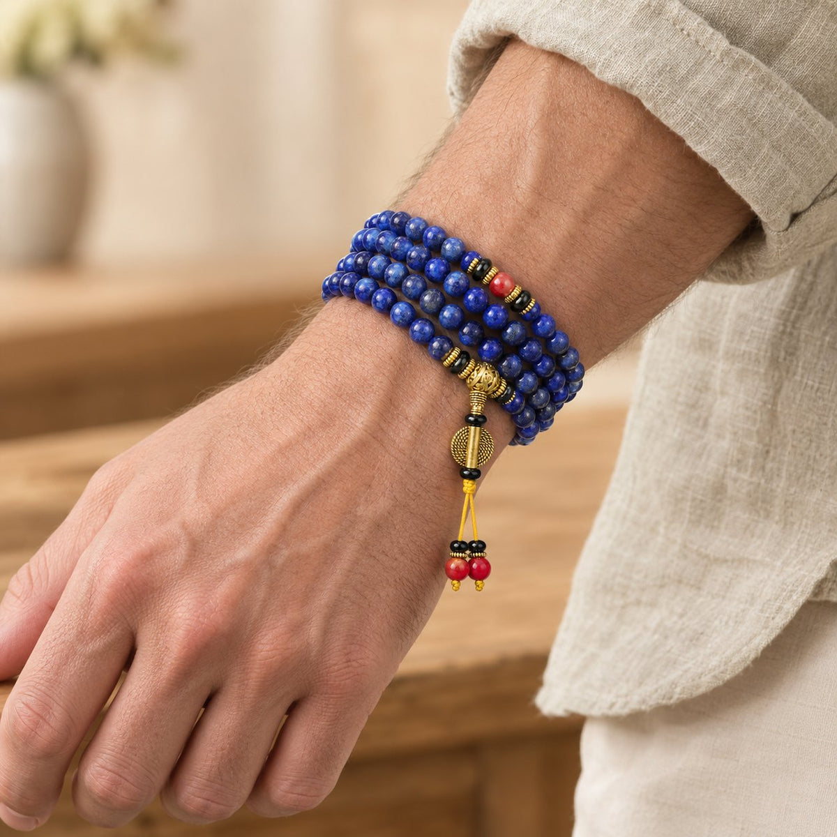 108 Beads Lapis Lazuli Positive Tibetan Mala Bracelet, worn on the wrist by a man