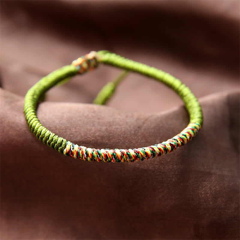 Mehrfarbiges tibetisches King Kong Knoten-Armband mit roter Schnur