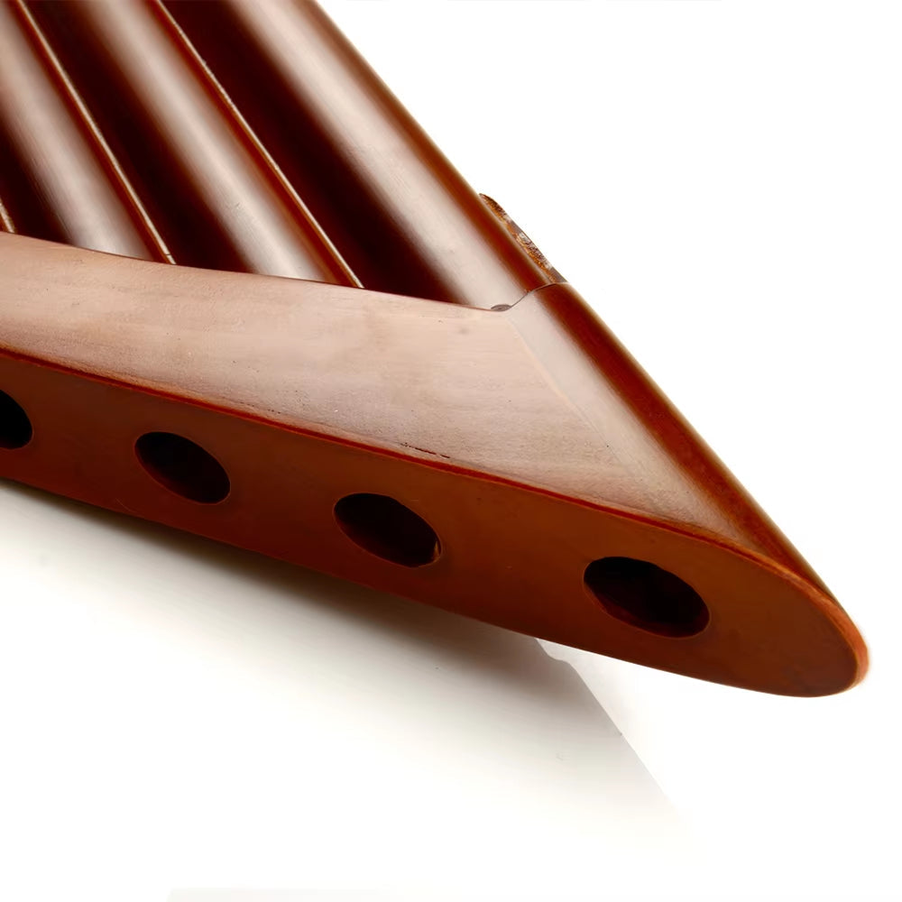 Brown Ocarina with four finger holes in a Natural Bamboo Pan Flute, Key of G