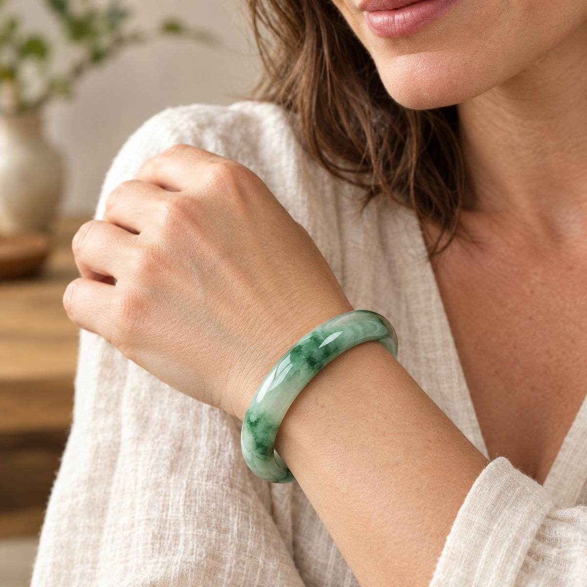 55mm Natural Jade Fortune Blessing Bangle Bracelet, worn on the wrist by a woman