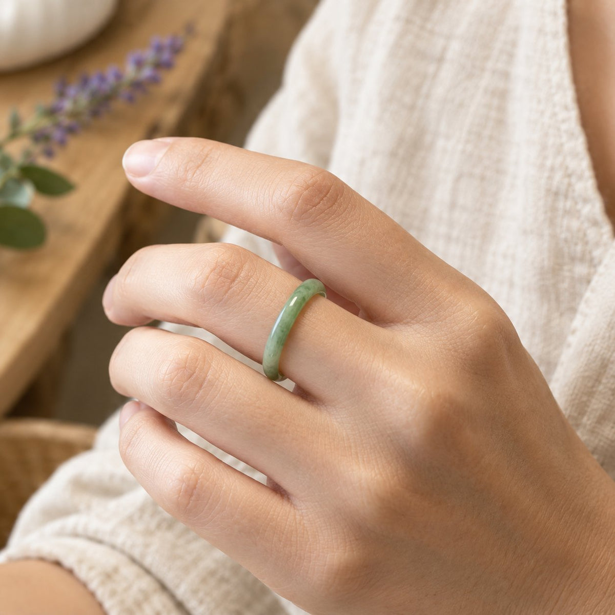 Natural Jade Prosperity and Abundance Ring, worn on the finger by a woman