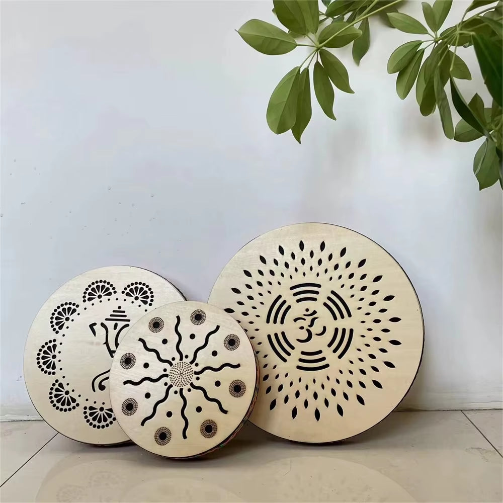 Two ornate circular drums with mandala patterns for Ocean Drum Instrument in yoga and meditation