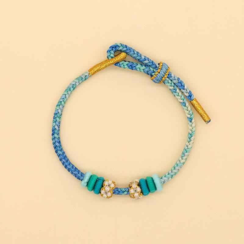Friedensknoten-Armband mit acht roten Fäden für Glück und Harmonie