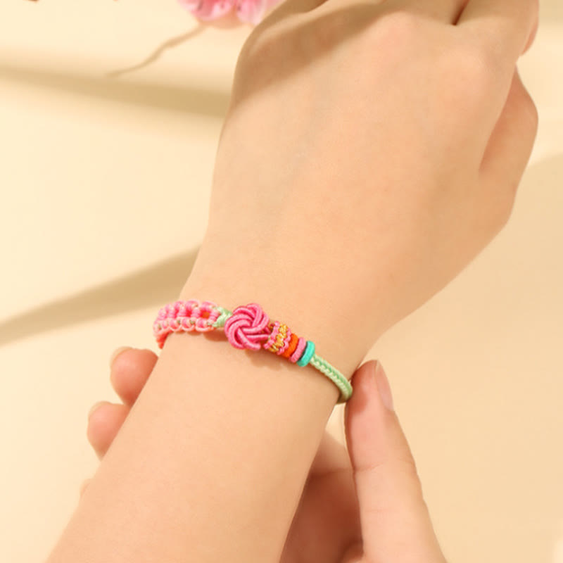 Pfirsichblütenknoten-Armband mit roter Schnur für Schutz und Liebe