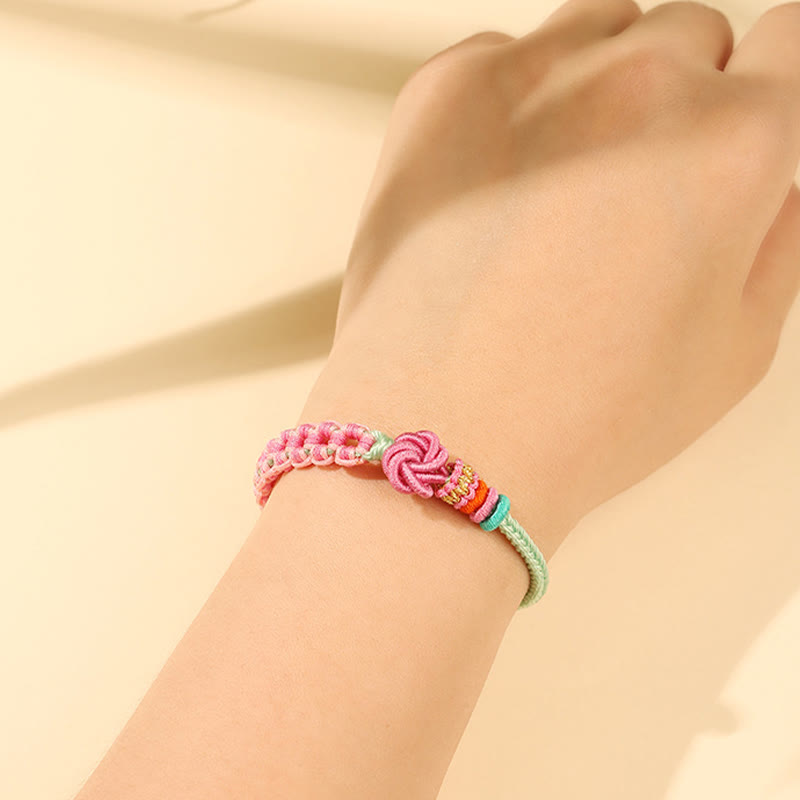 Pfirsichblütenknoten-Armband mit roter Schnur für Schutz und Liebe