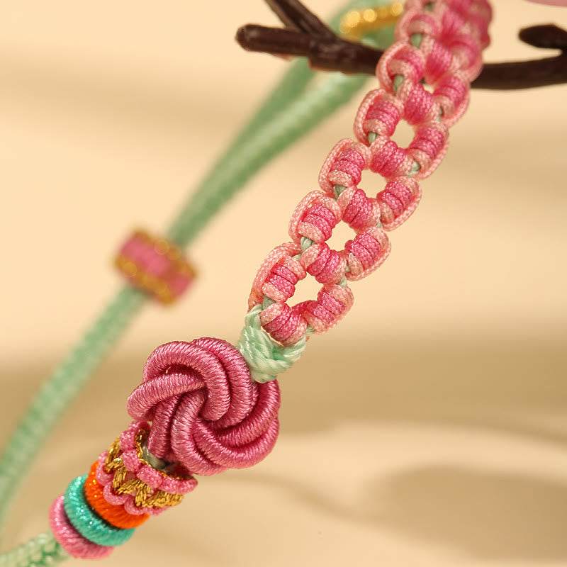 Pfirsichblütenknoten-Armband mit roter Schnur für Schutz und Liebe