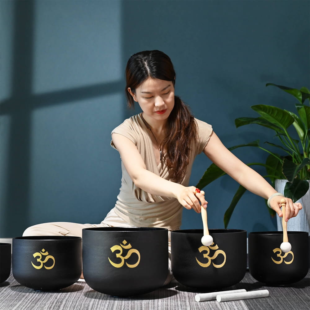 Black singing bowls with golden Om symbols in Perfect Pitch Black OM Symbol set