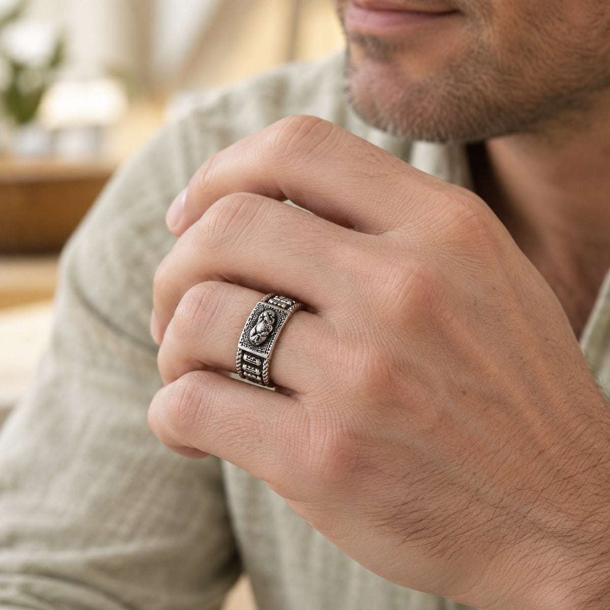 Unisex Pixiu Wealth Prayer Wheel Ring, worn on the finger by a man