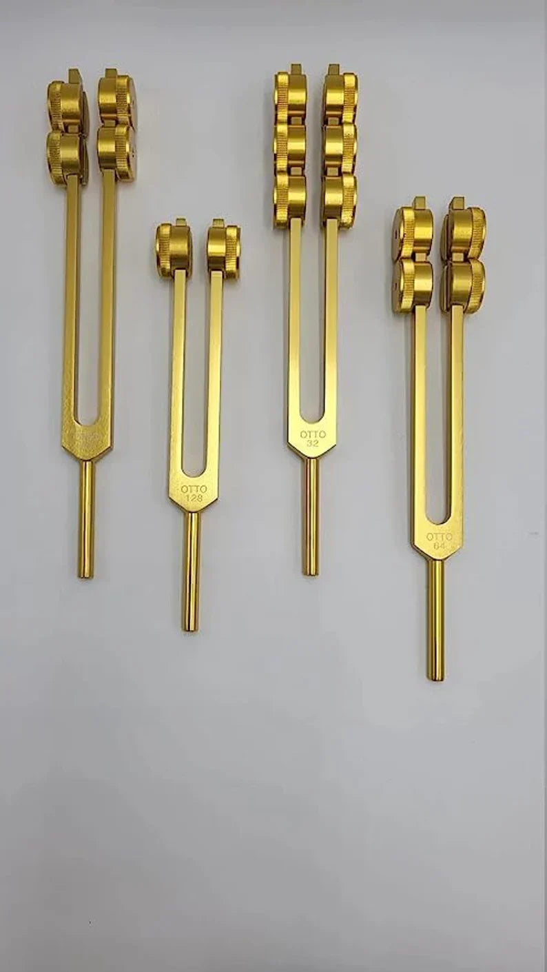 Golden tuning forks with weighted double prongs in Professional Otto Tuners set