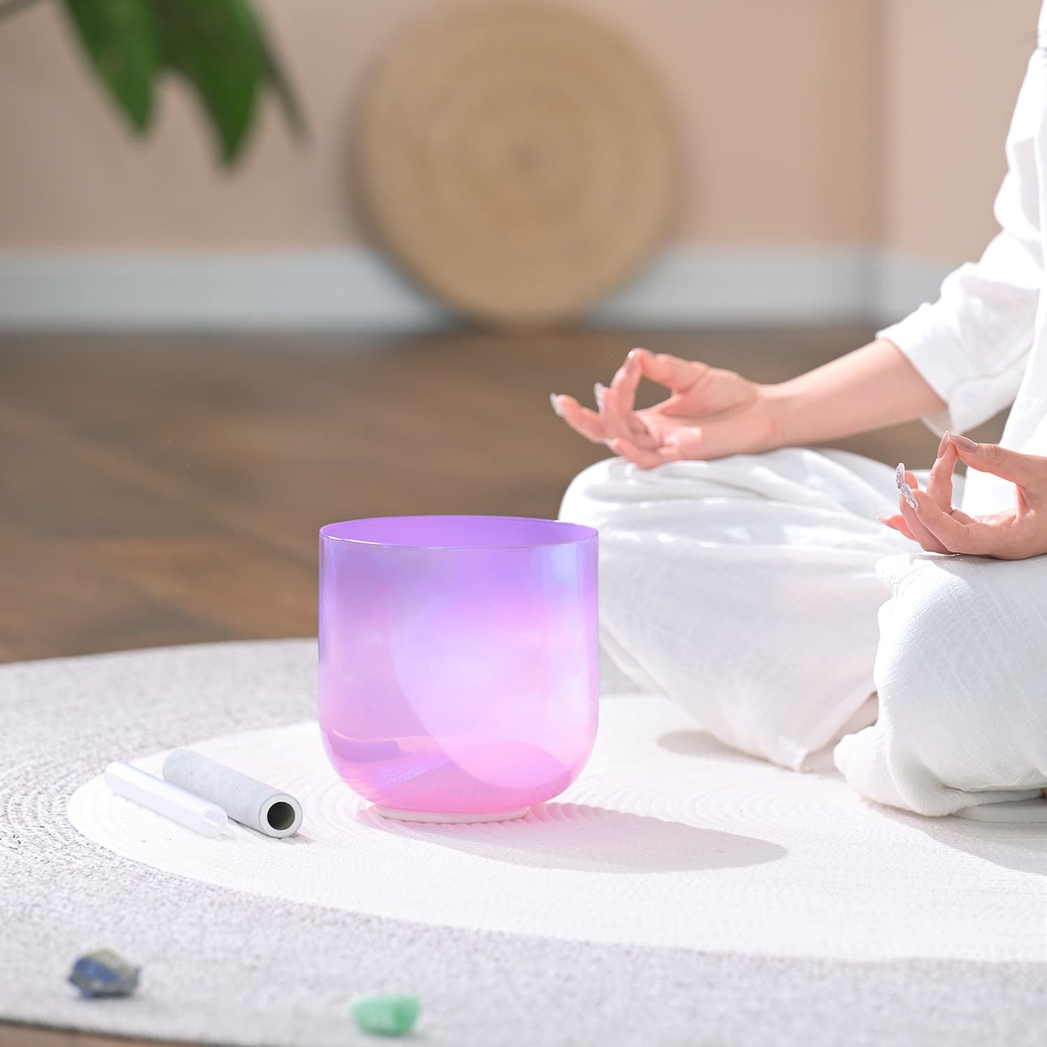 Purple Crystal Singing Bowl glowing with pink light for sound healing meditation