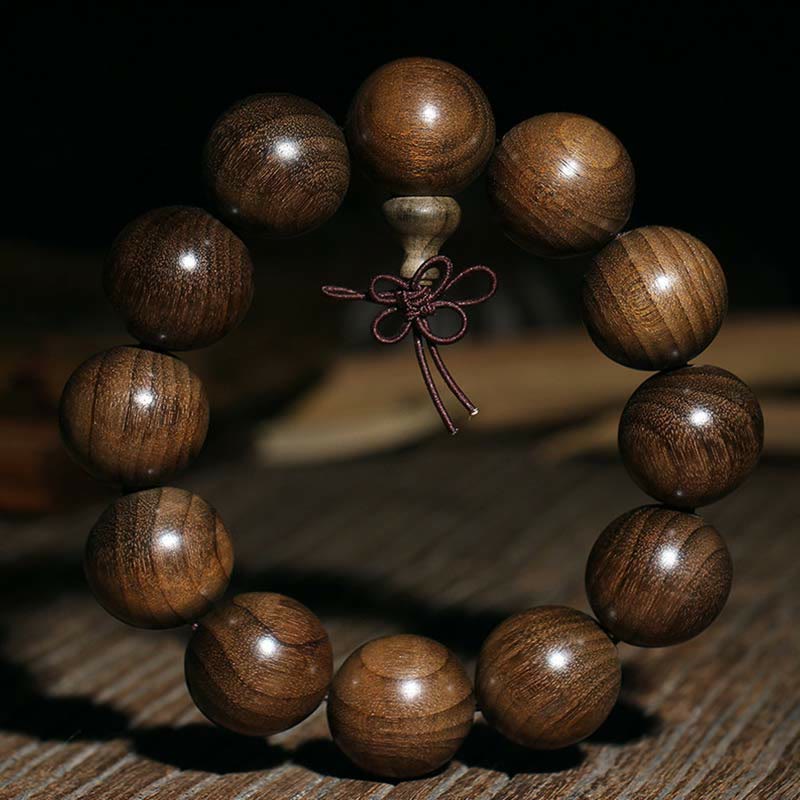 Seltenes spirituelles Armband aus Phoebe Zhennan-Holz, 15–25 mm Perlen