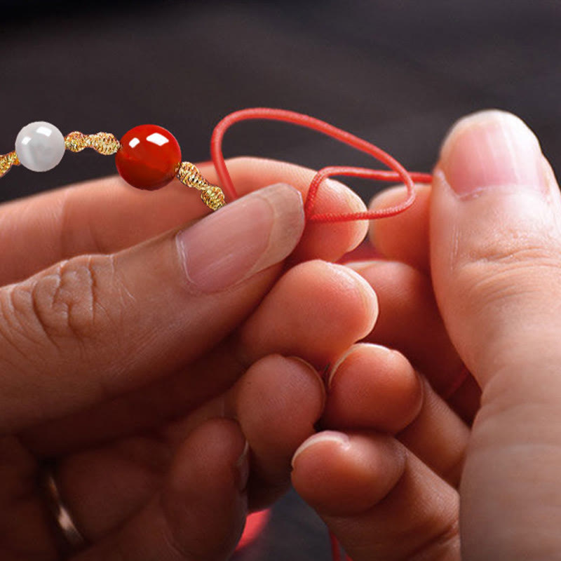 Geflochtenes Armband oder Halskette mit rotem Achat-Katzenauge