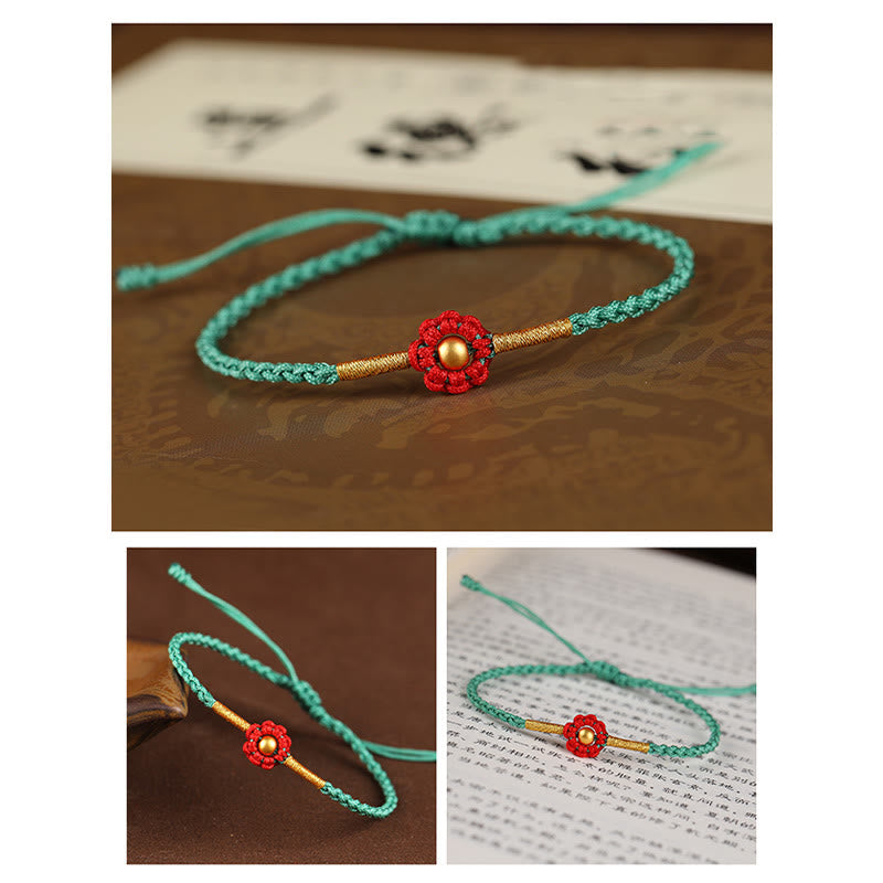 Rotes Schutzarmband mit goldener Blume