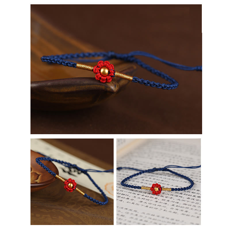 Rotes Schutzarmband mit goldener Blume