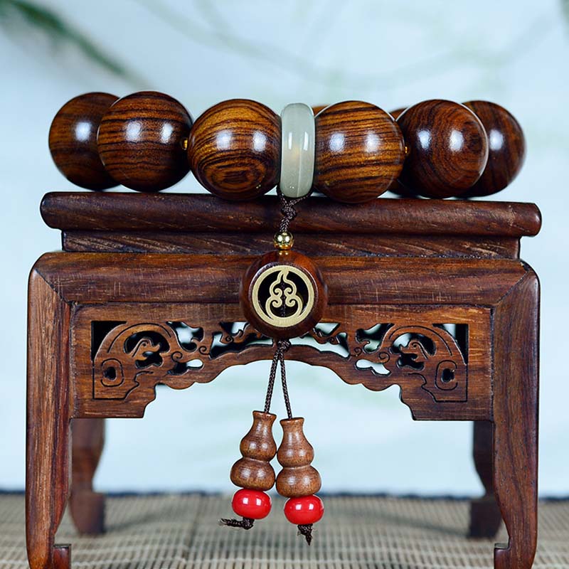 Spirituelles Armband mit Rosenholz-Kürbis-Charme für ruhigen Schutz