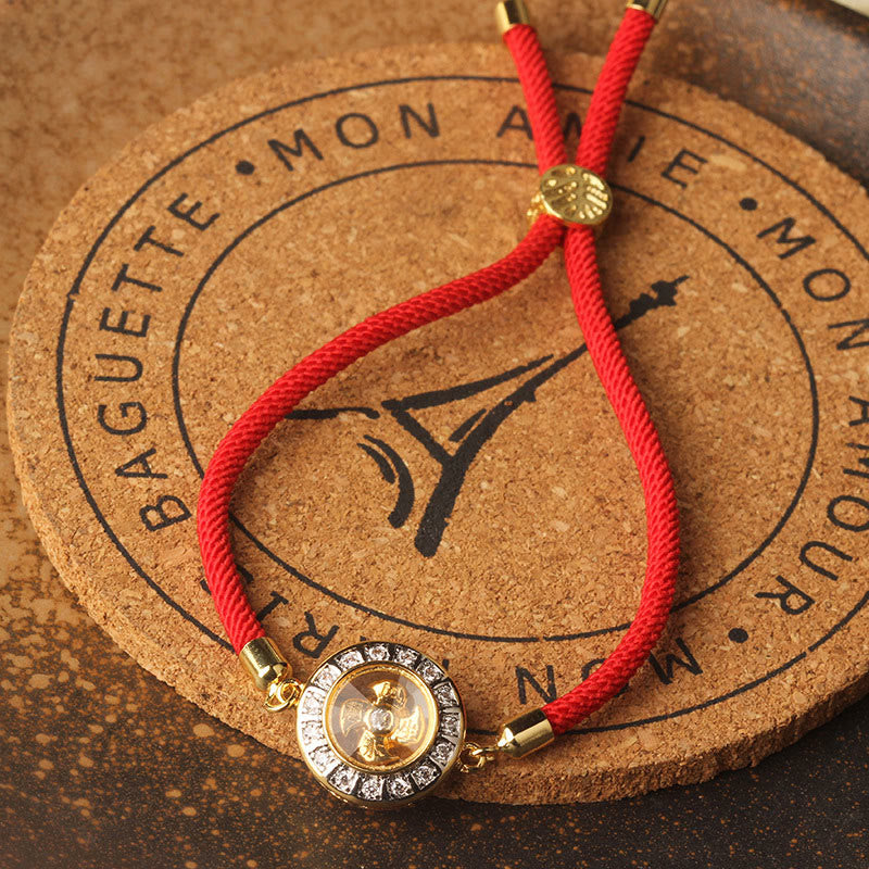 Drehbares Kupfer-Messing-Windmühlen-Armband mit roter Schnur