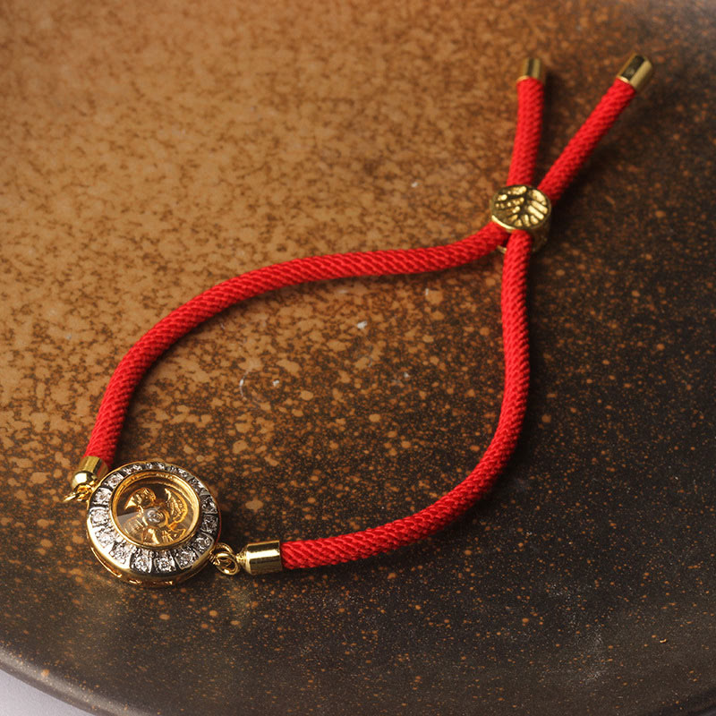 Drehbares Kupfer-Messing-Windmühlen-Armband mit roter Schnur