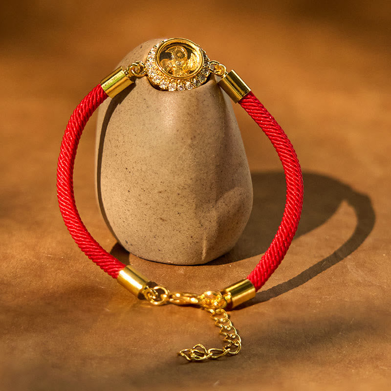 Drehbares Feng-Shui-Armband aus Kupfer mit roter Windmühlenschnur zum Schutz
